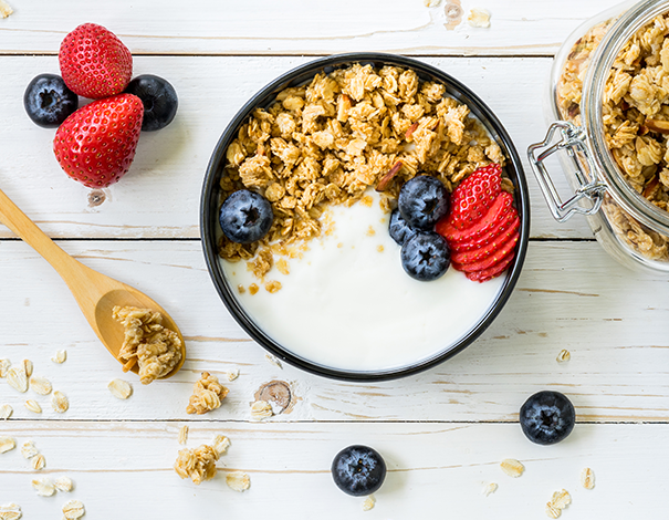 Bowl of yogurt and cereal on a counter - Probiotics