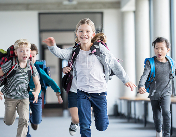 kids running in the school hallway