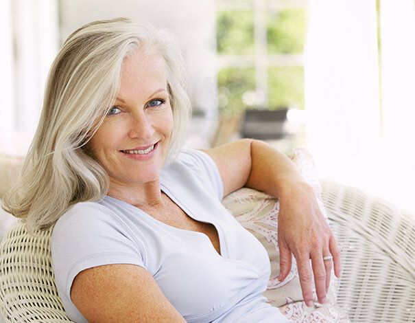 Senior woman with grey hair smiling